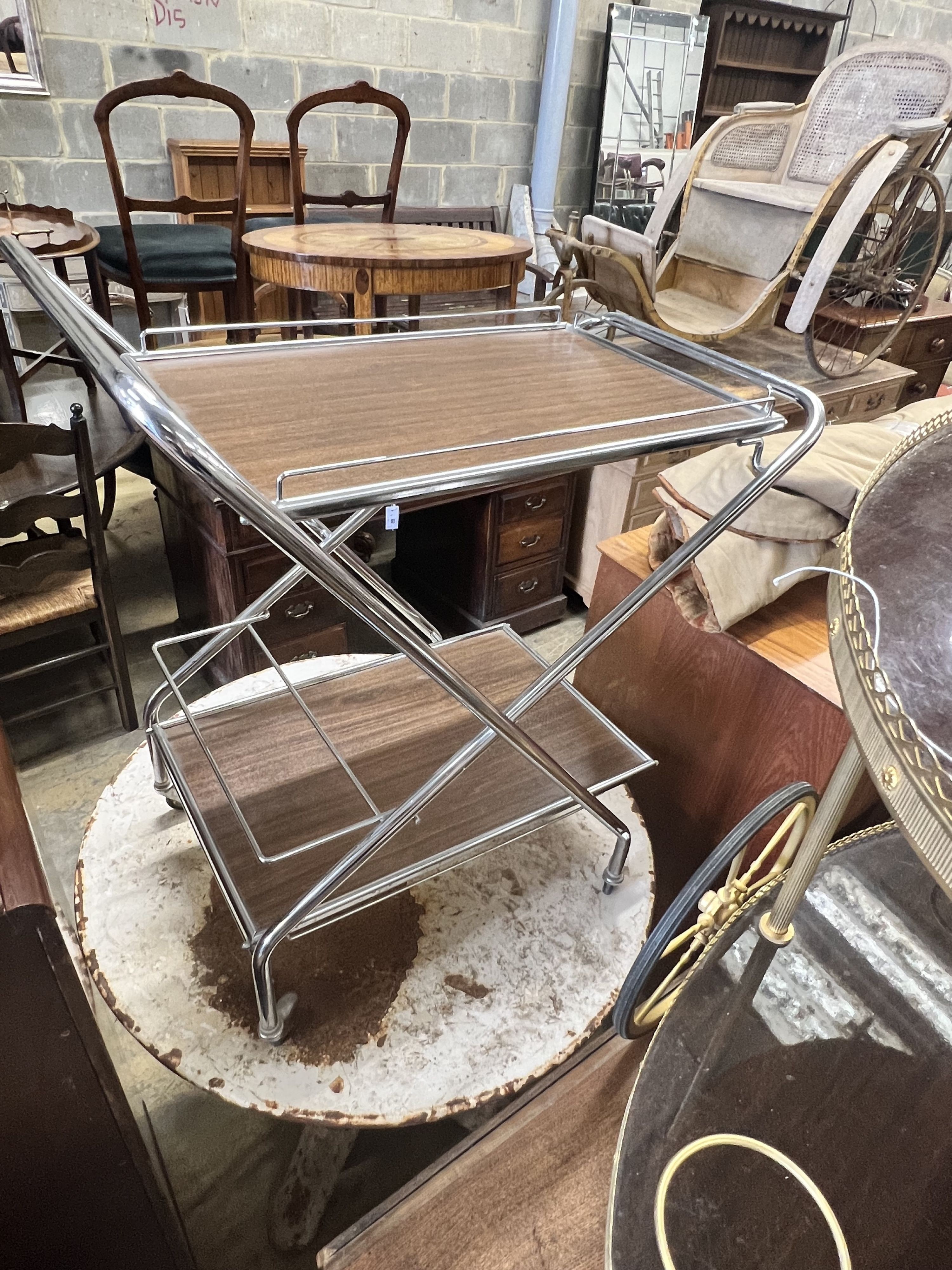 An oval gilt metal tea trolley, height 79cm, together with a smaller chrome folding tea trolley